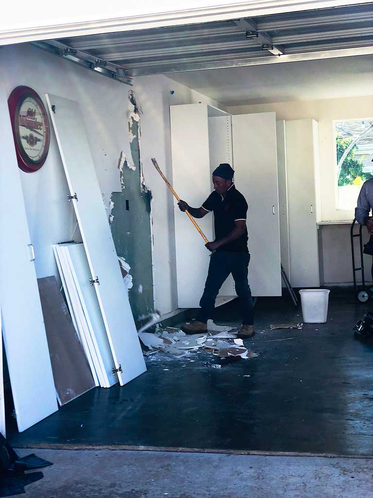 garage conversion beginning to remove the drywal