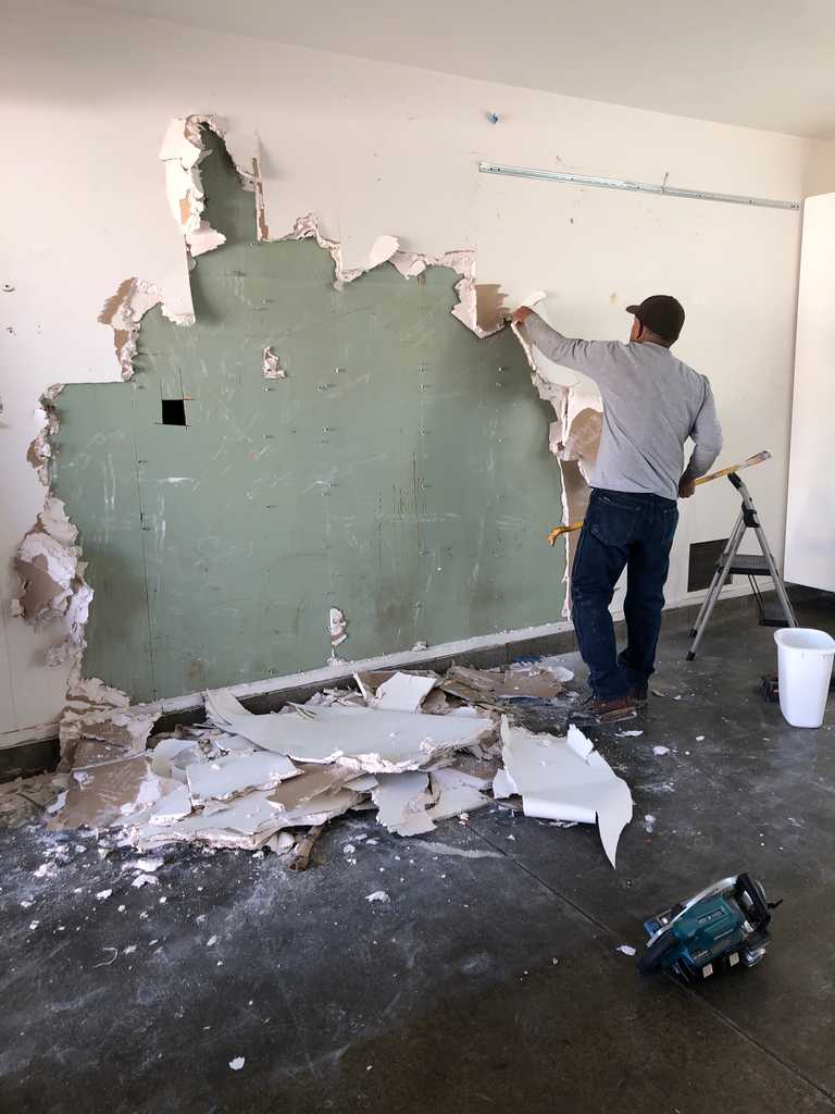 garage conversion tearing out the old wall