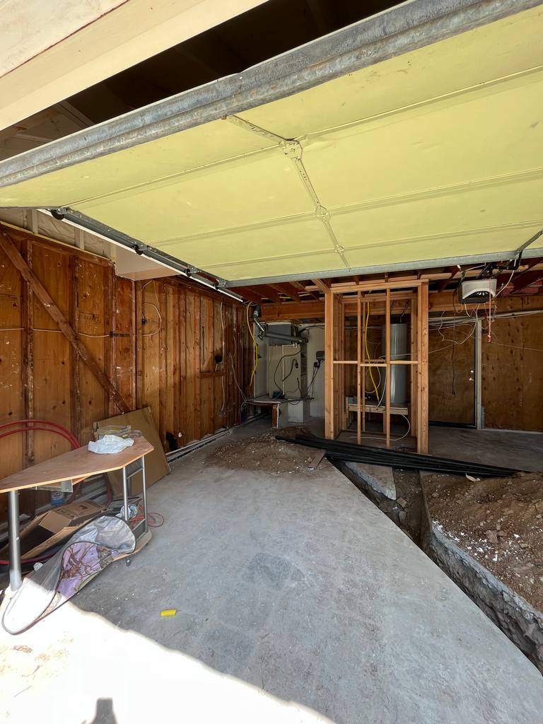 Concrete floor saw cutting for plumbing and drainage installation.