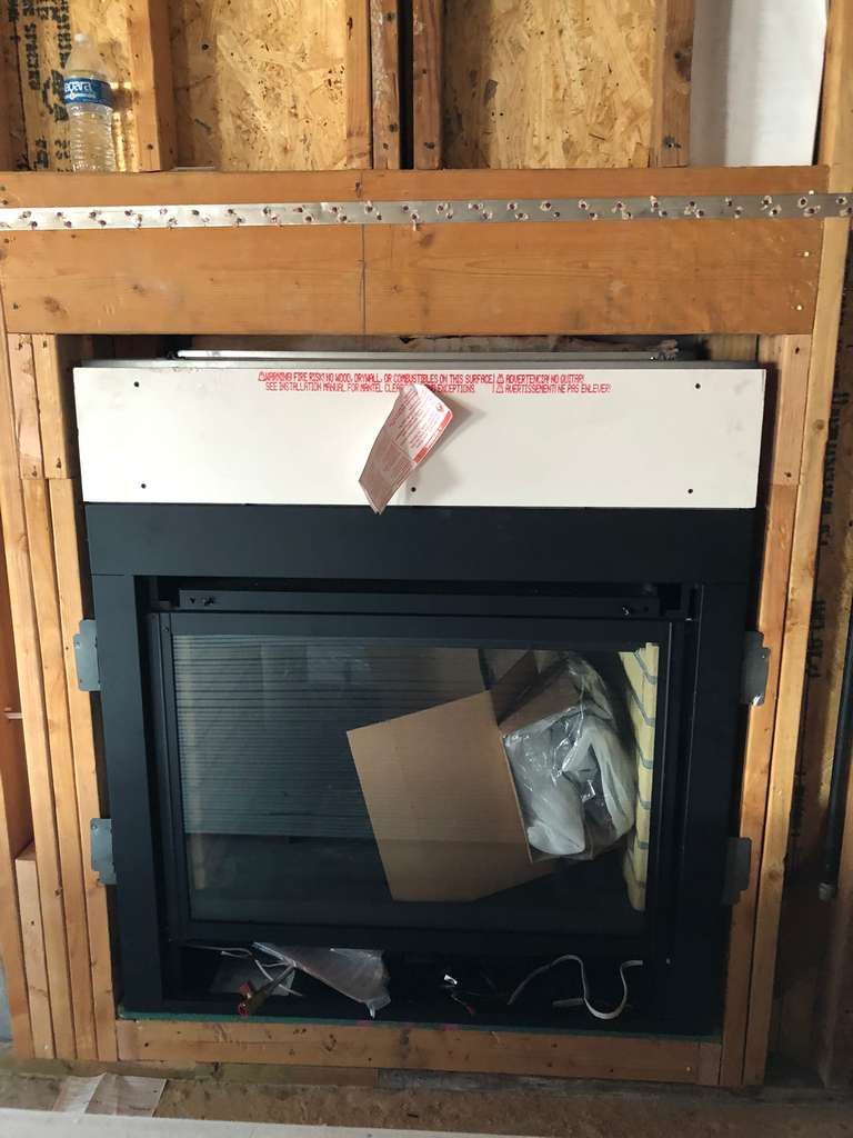 setting-Electric-Furnace-Heater-Smokeless-Fireplace-in-the-prepared-opening