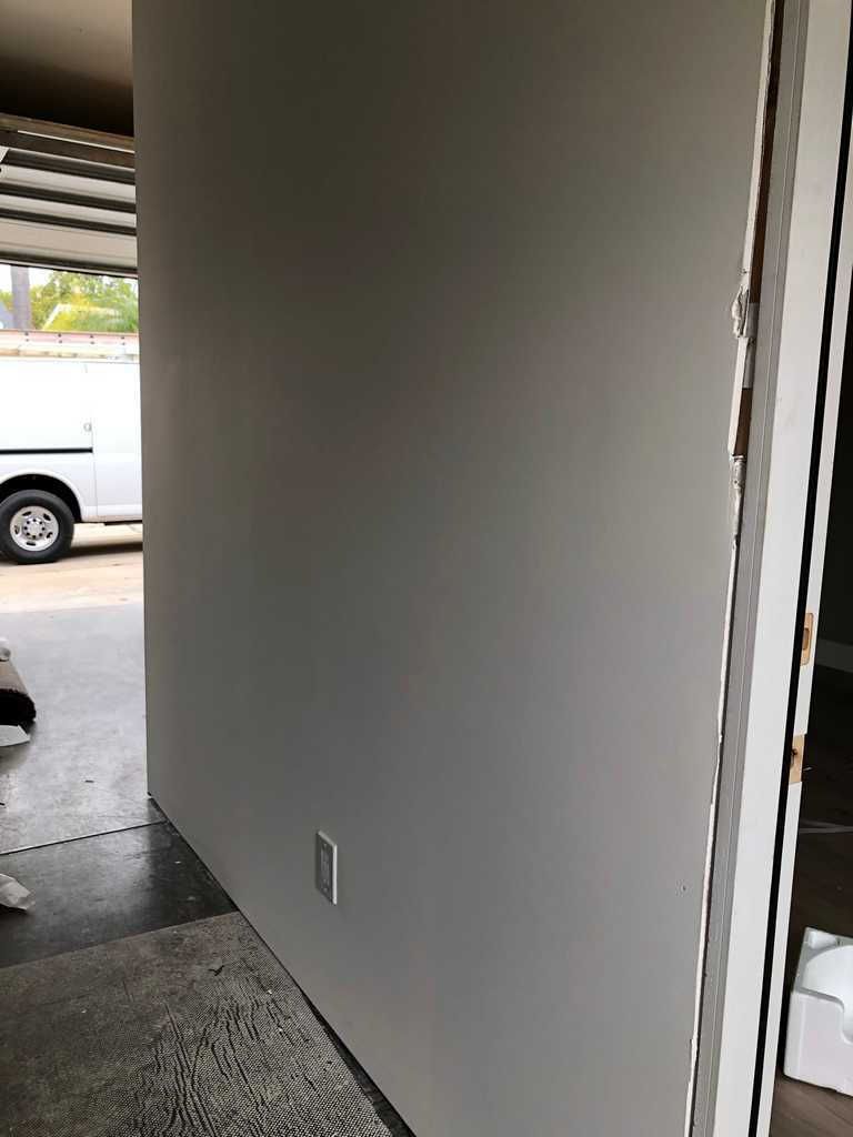 garage conversion dividing wall with textured drywall