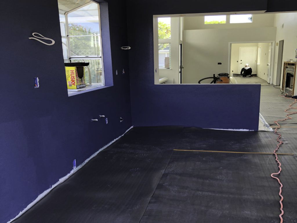 Attached Vapor Barrier Underlayment throughout the house, a2mContractors