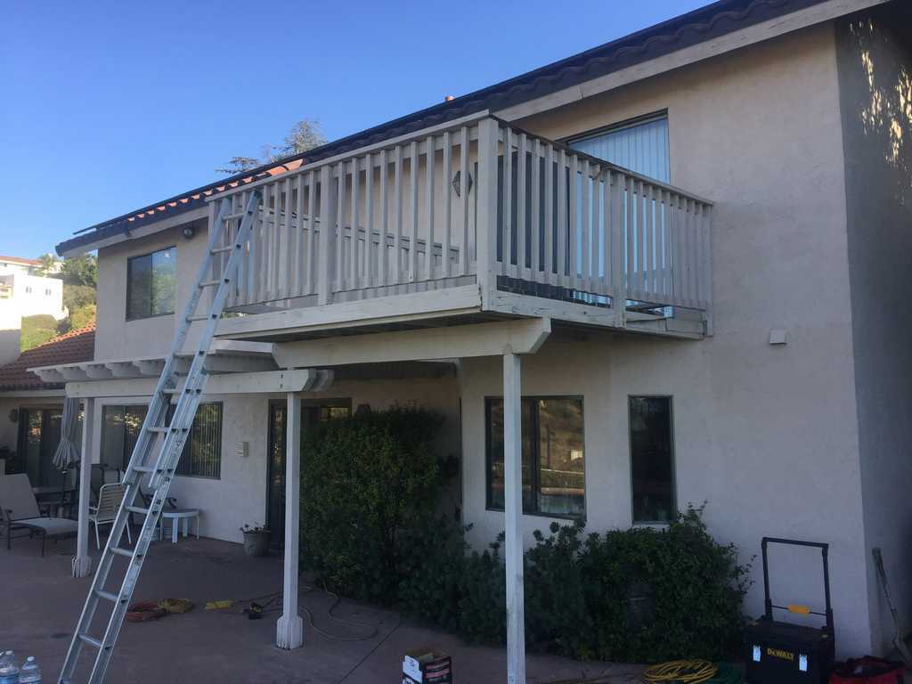 a2mContractors finsihing a two-story wood deck