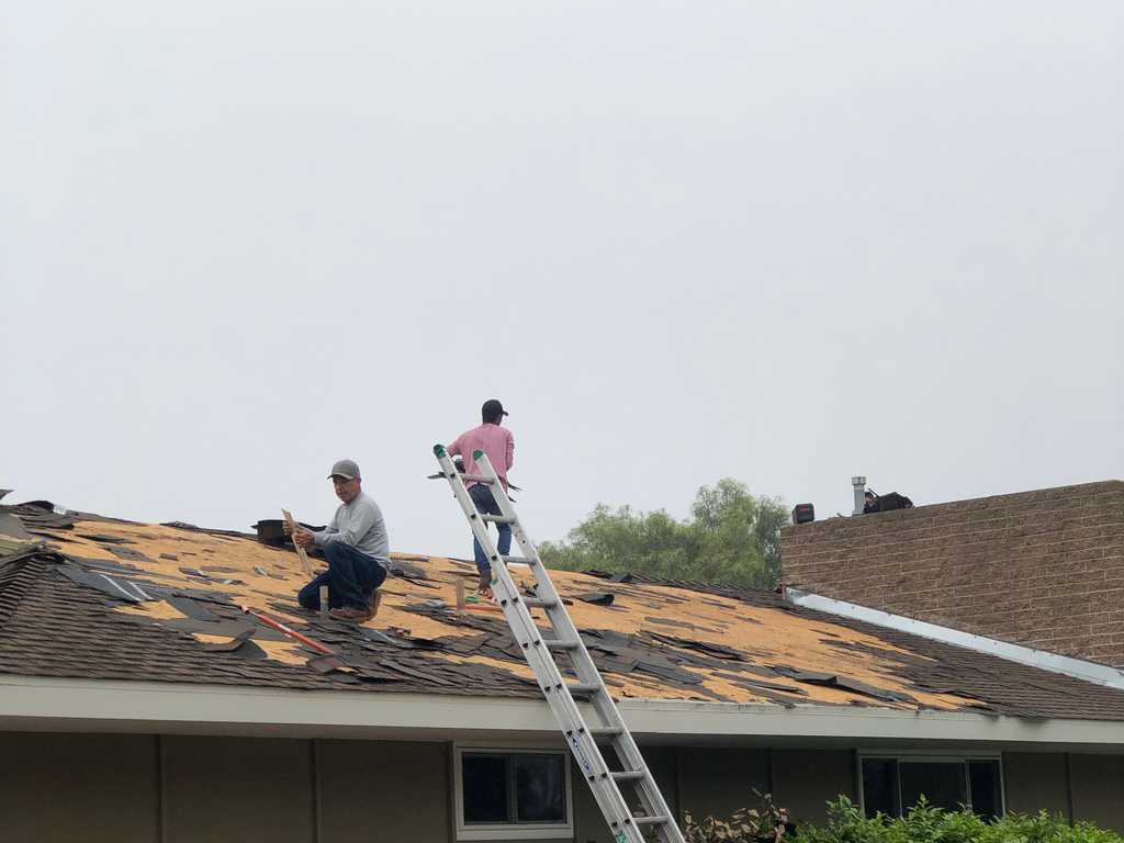 a2mContractors roof tear down to roof sheating