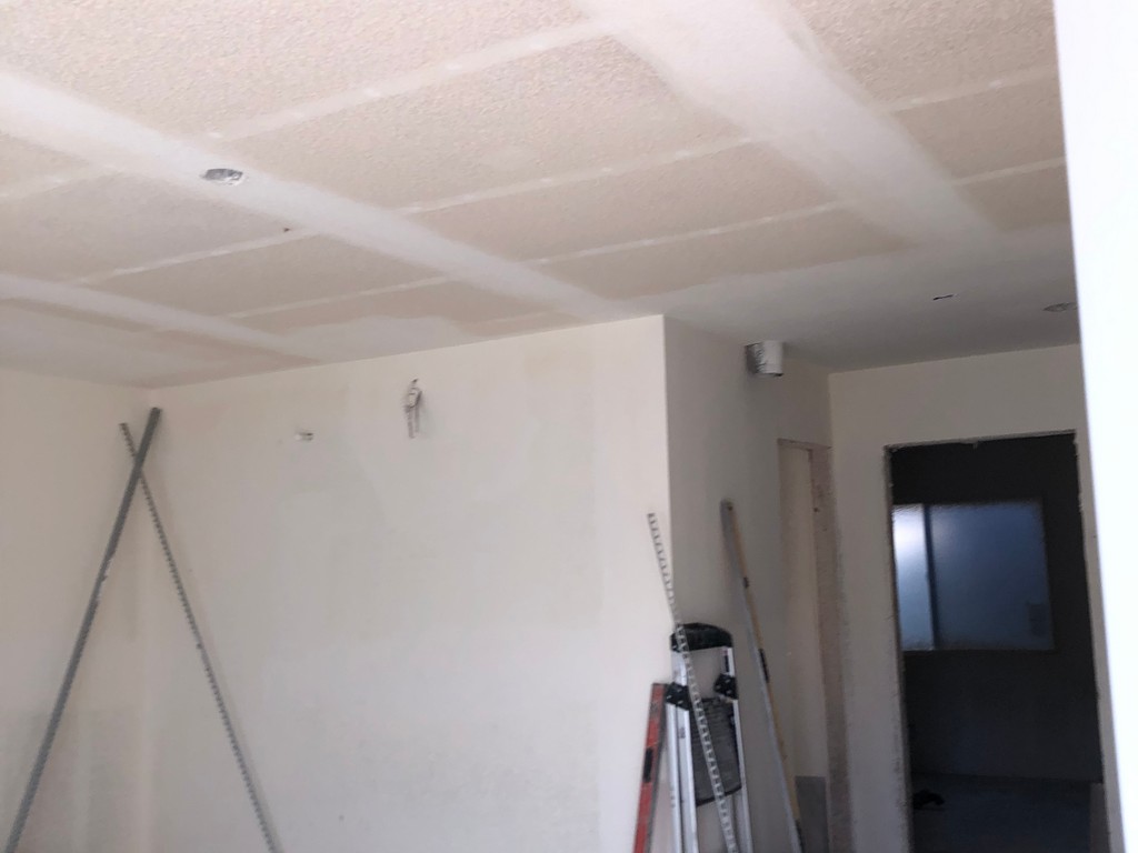 0104_drywall with-and-mud-applied-to-ceiling-in-front-room-remodel