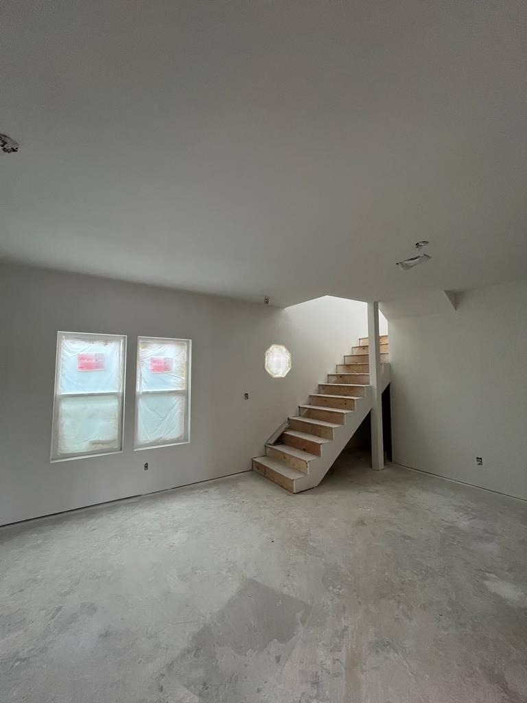 Framed stair structure inside residential remodel project.