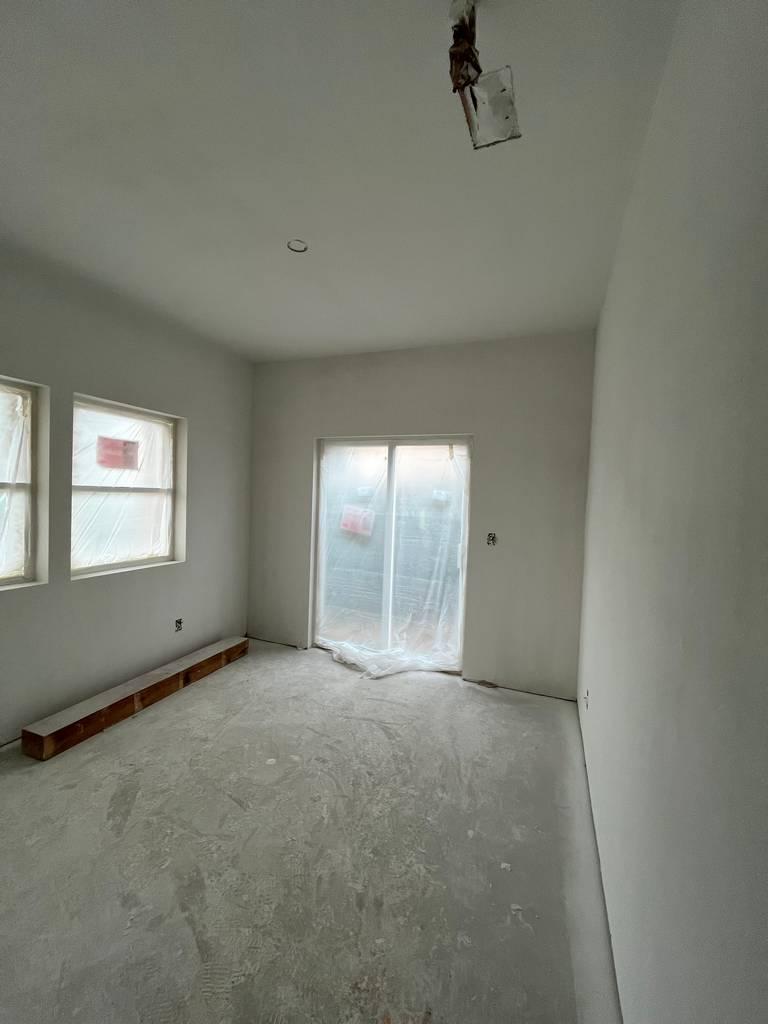 Interior remodel with drywall hung and seams taped.