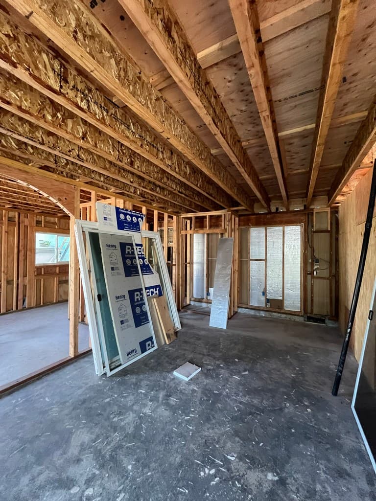 Vinyl window units staged inside framed ADU.