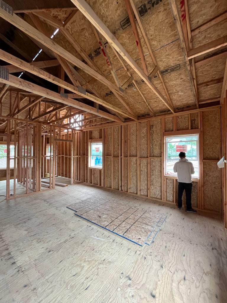 Interior framing for vinyle windows  installation with visible header support.