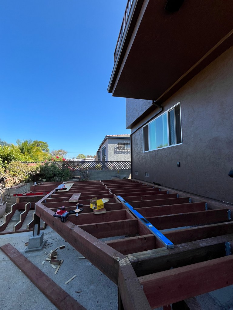 Completed pressure-treated deck framing ready for decking