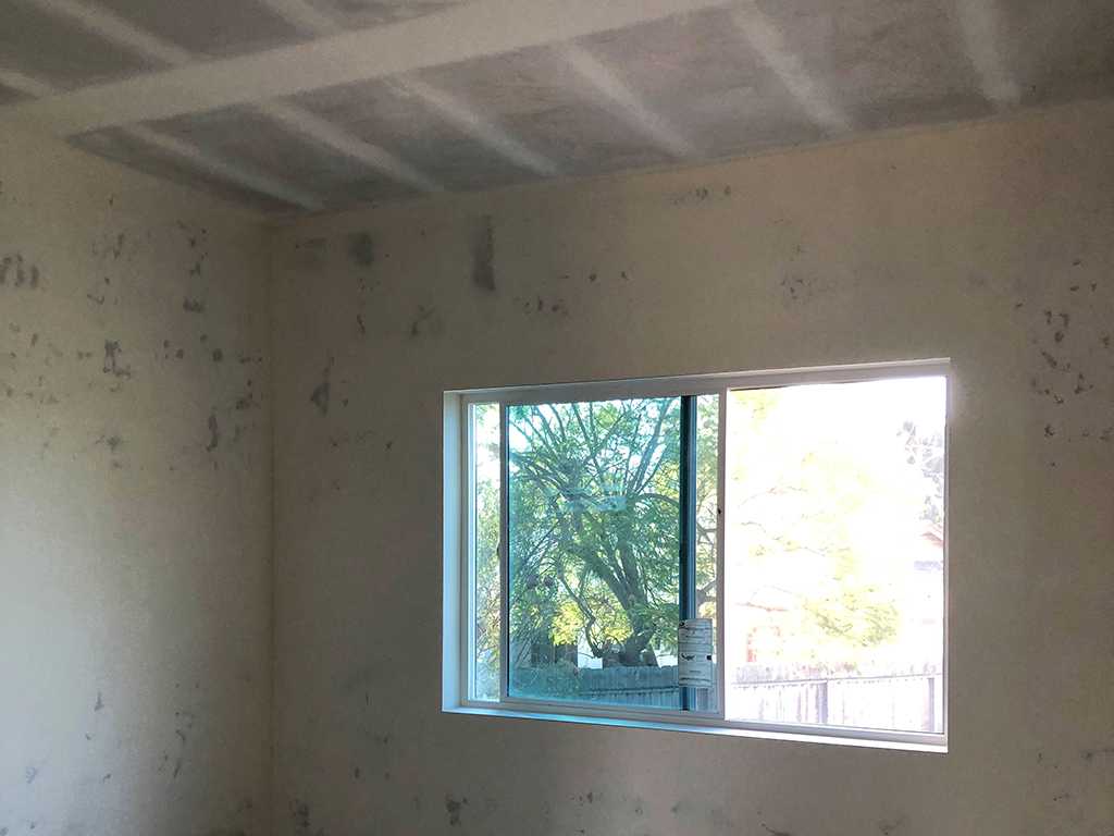 ceiling drywall work showing mud and tape finish