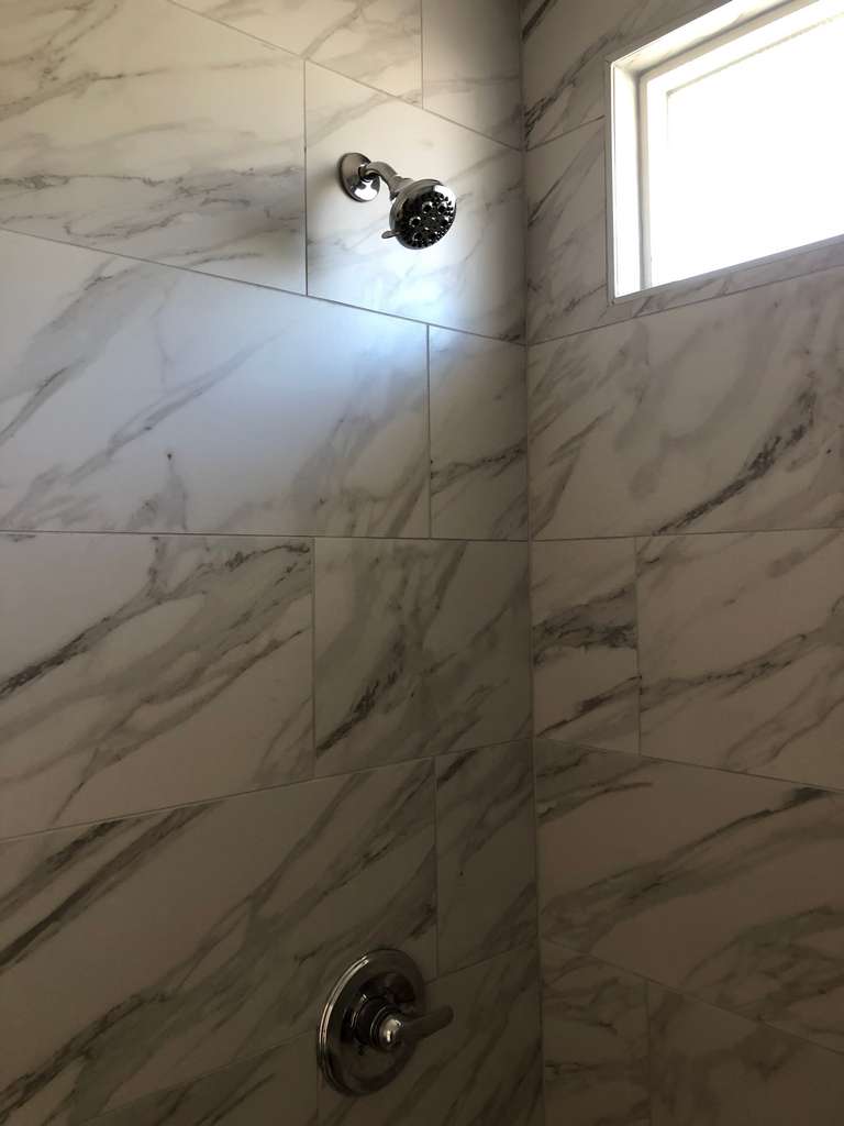 ADU-showing-beautifully-designed-marble-shower-wall 