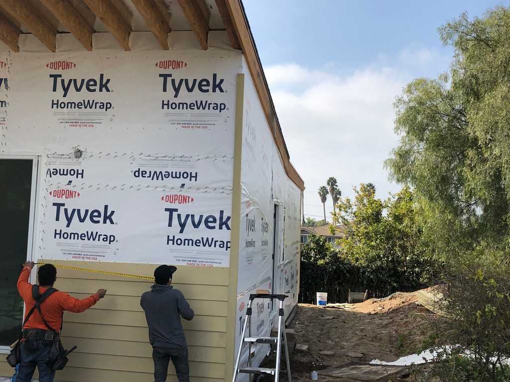 covering the Tyvek HomeWrap with wood siding