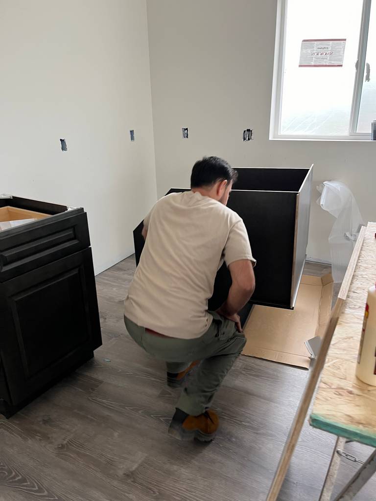 Skilled Carpenter Assembling Custom Storage Cabinets