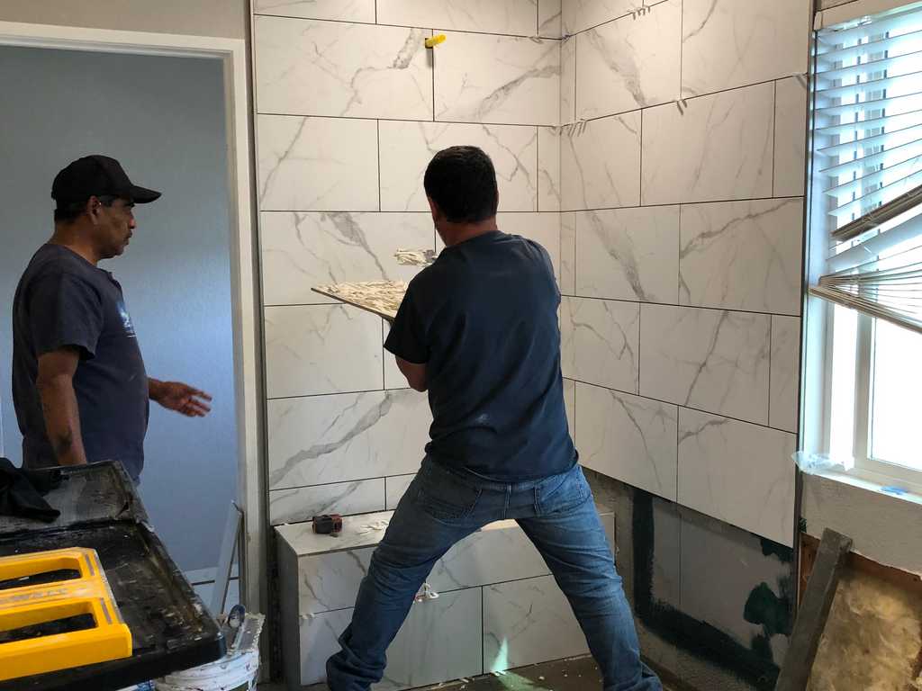 bathroom remodel A2M Contractors grouting tile