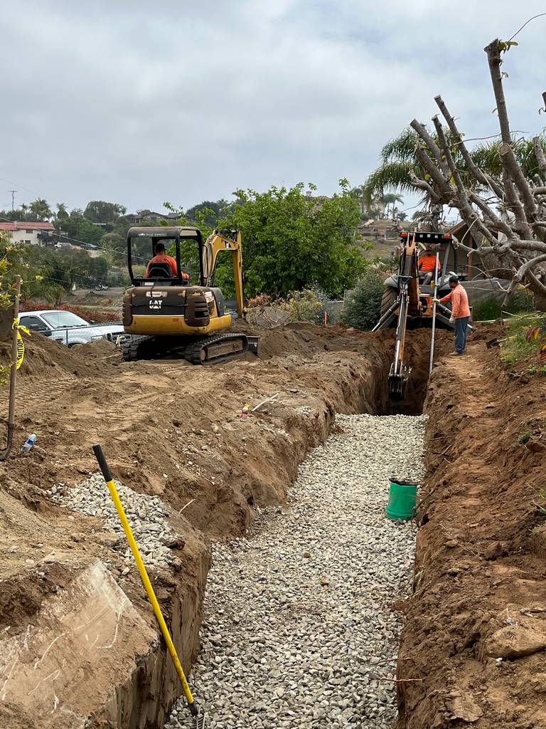 backhole digging foundation for the ADU
