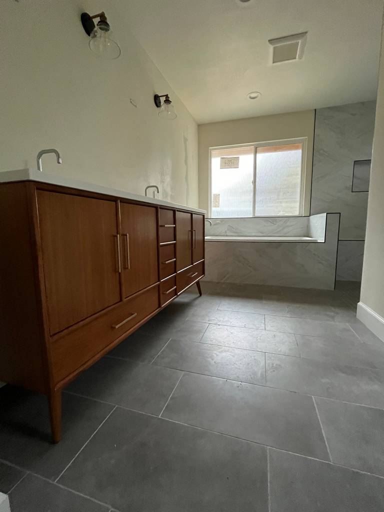 Custom designed bathtub with marble walls