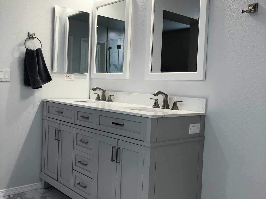 new vanity with dual basins, mirrors and finsihed wall