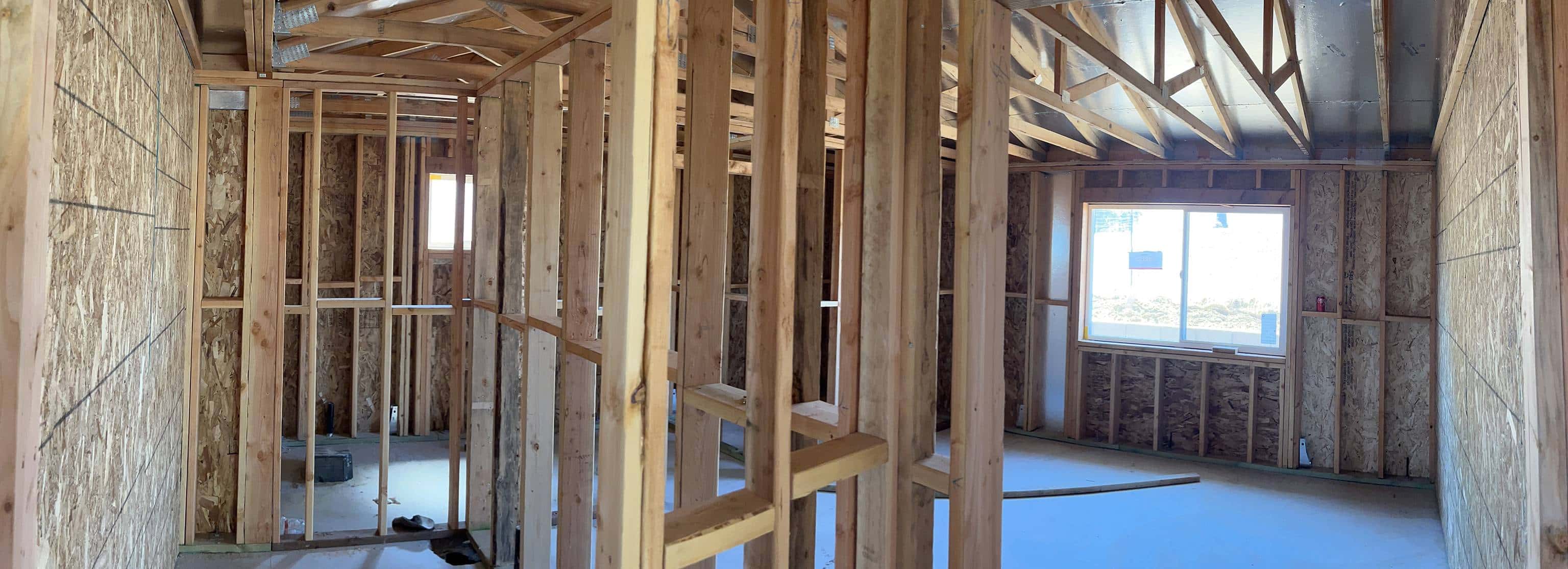vertical wooden studs to divide rooms