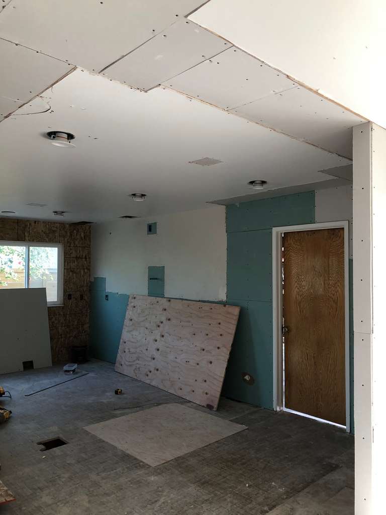 sheetrock installed on the ceiling